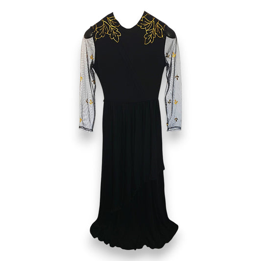 Vestido negro con hojas doradas de Vera Mont